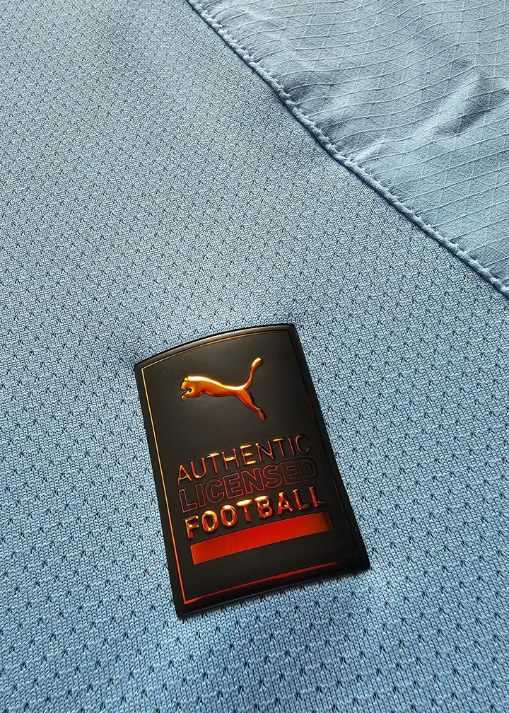 Close-up of the Puma tag showing &