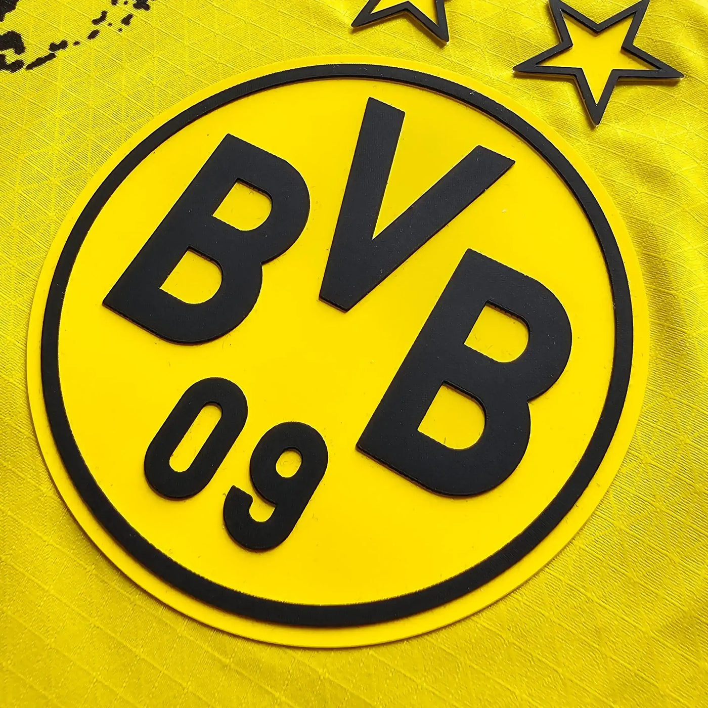 Borussia Dortmund BVB logo with stars on a yellow background