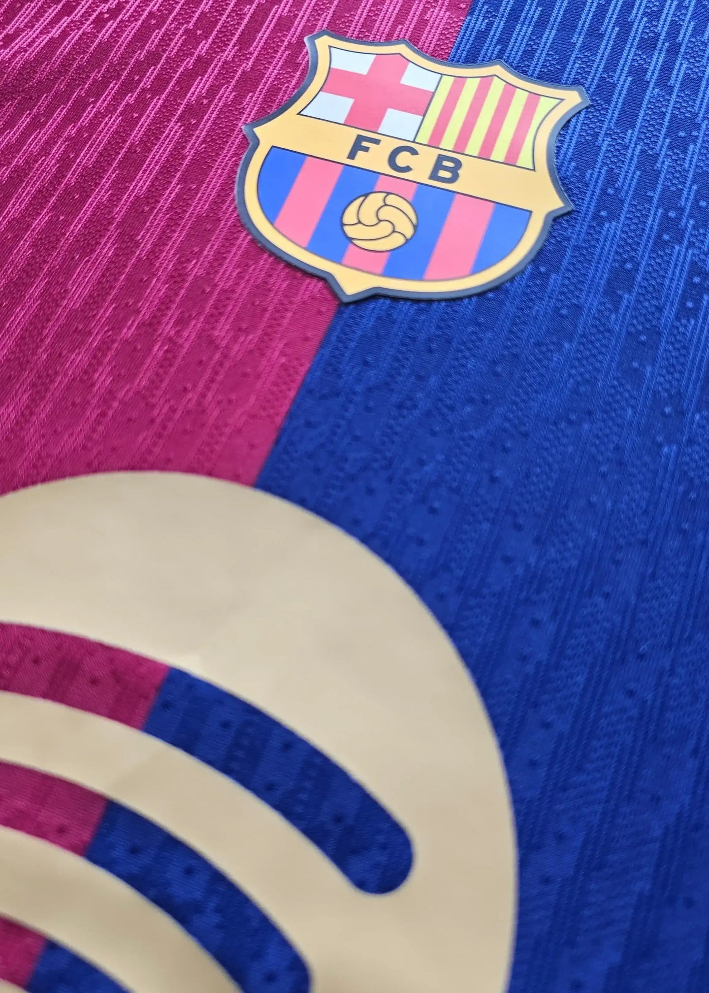 Crest detail showing the FC Barcelona badge with blue and red stripes.