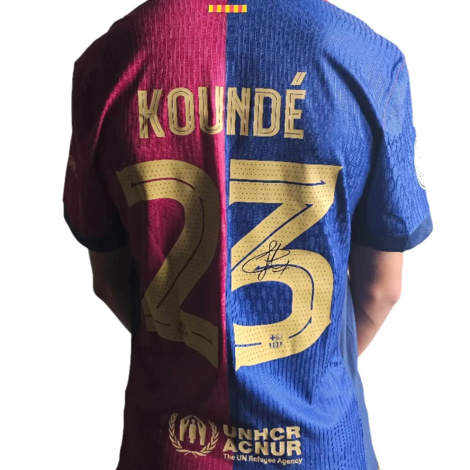 Back view showing Koundé, No. 23, and a visible signature on the Barcelona shirt.
