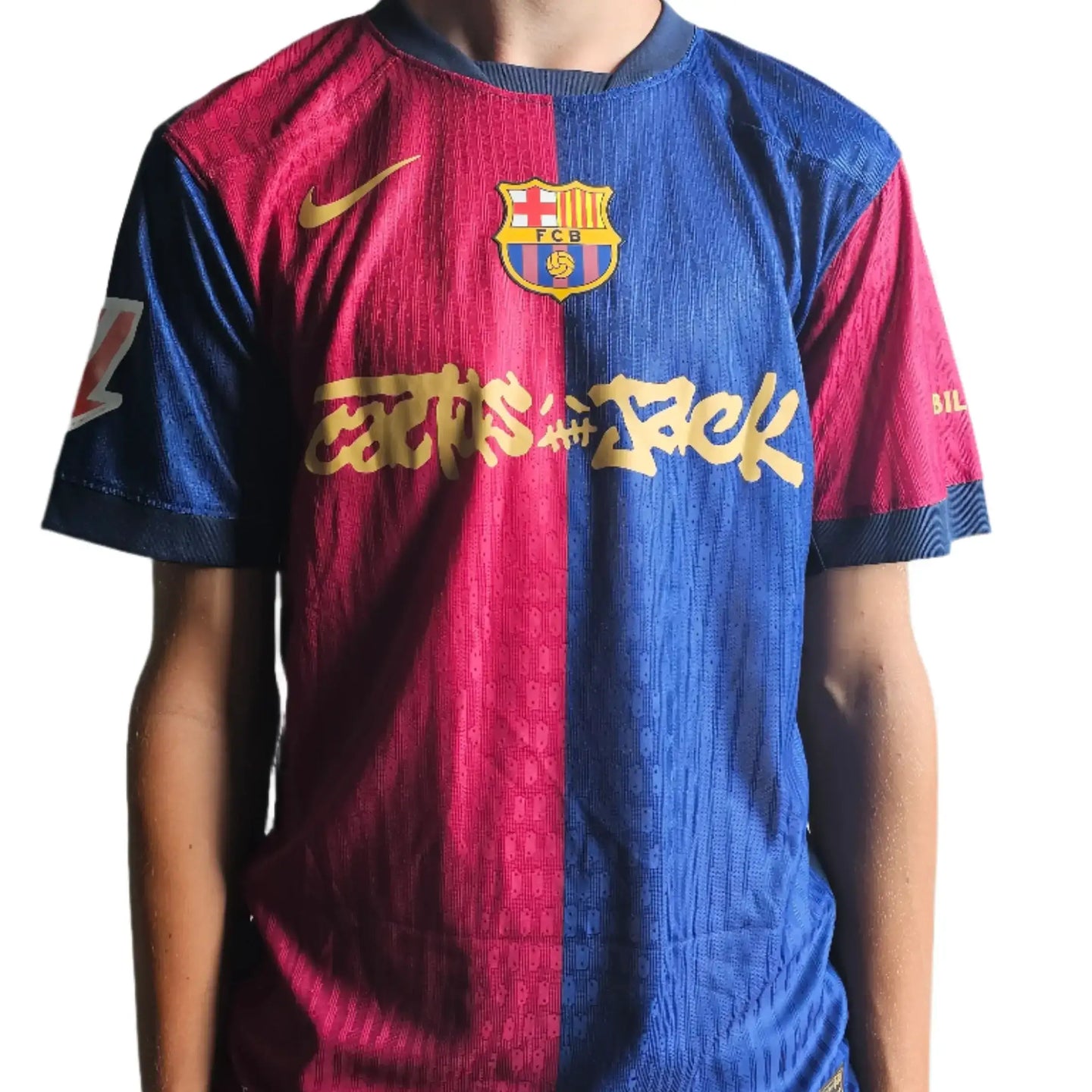 Front view of Barcelona football shirt with 'Cactus Jack' in gold, featuring the club crest.