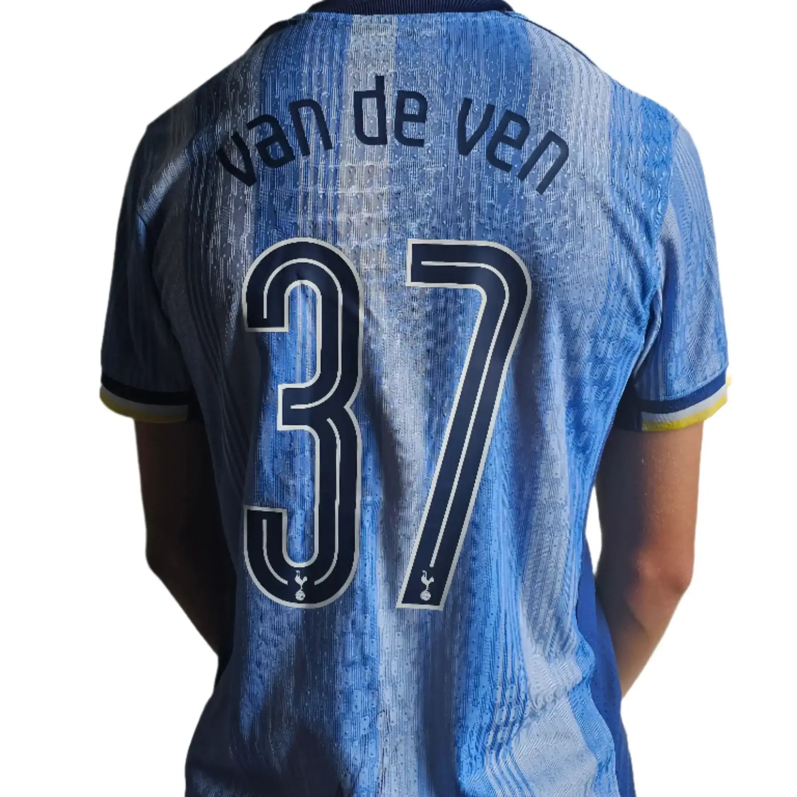 Back view showing van de ven and No. 37 on a blue Tottenham signed football shirt.
