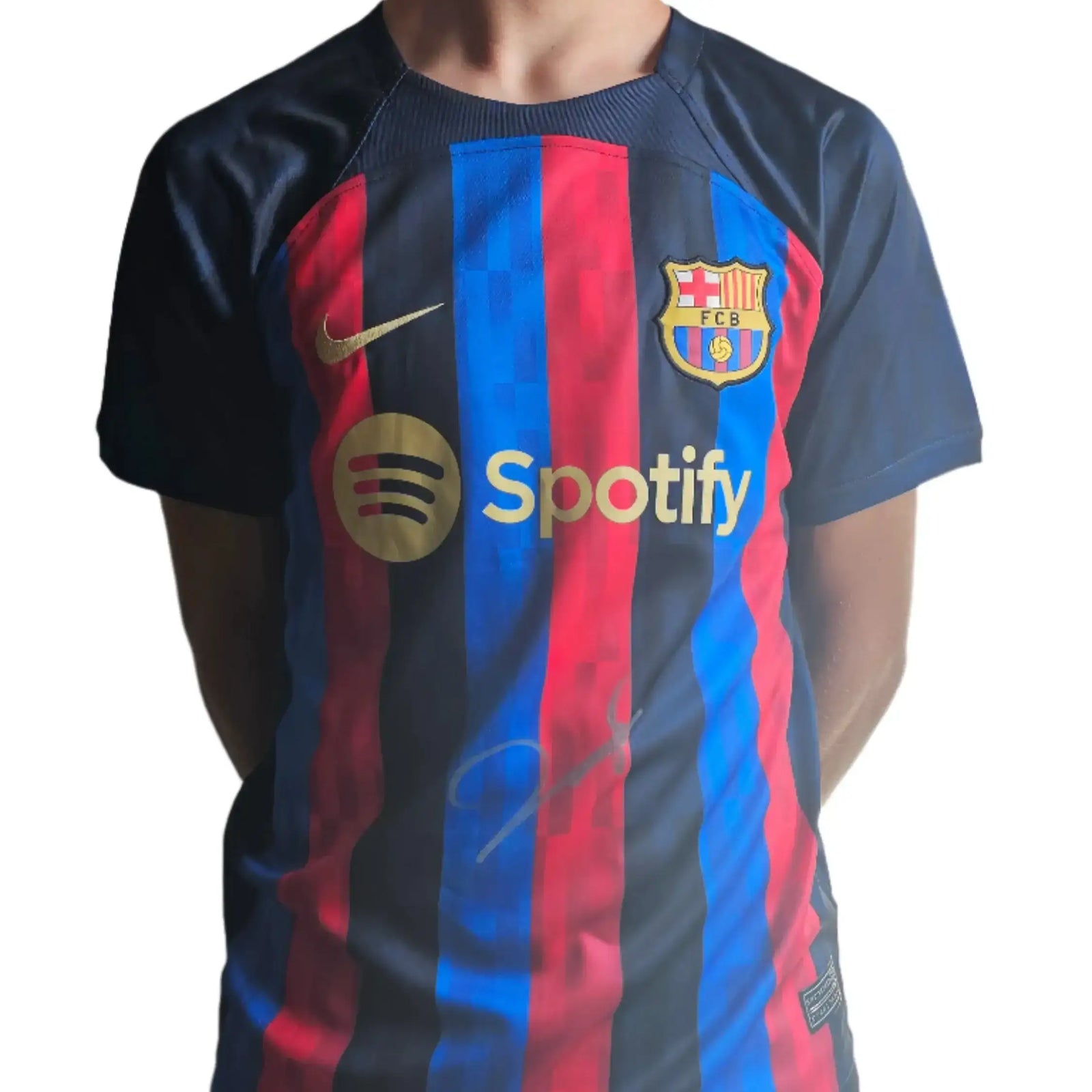Front view of a Barcelona football shirt featuring the crest, Spotify logo, and a signature.