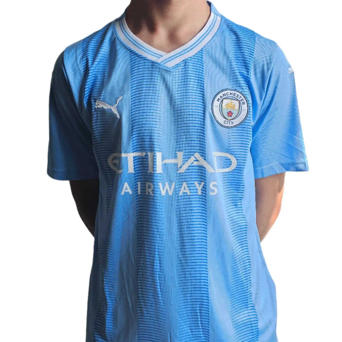 Front view featuring Manchester City crest and 'ETIHAD AIRWAYS' sponsor logo.