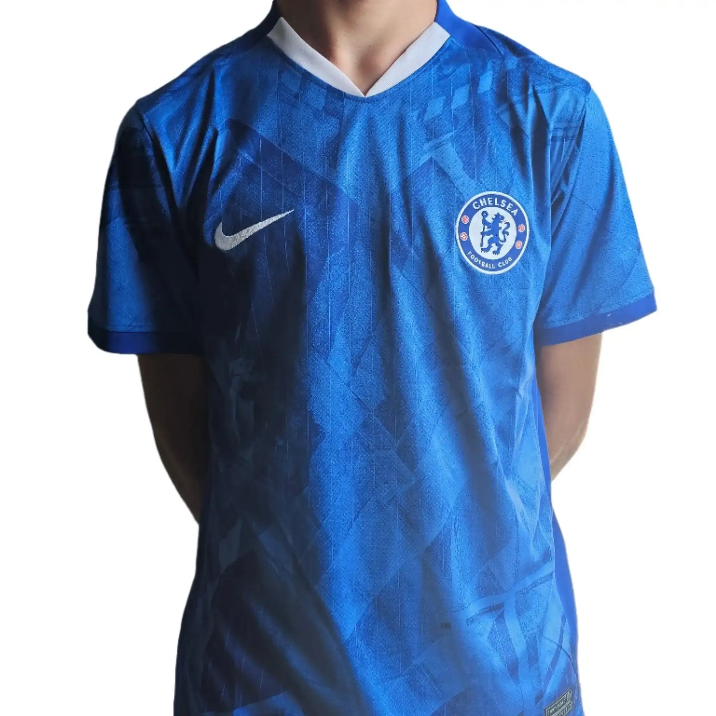 Back view showing Chelsea crest and blue pattern of the signed football shirt.