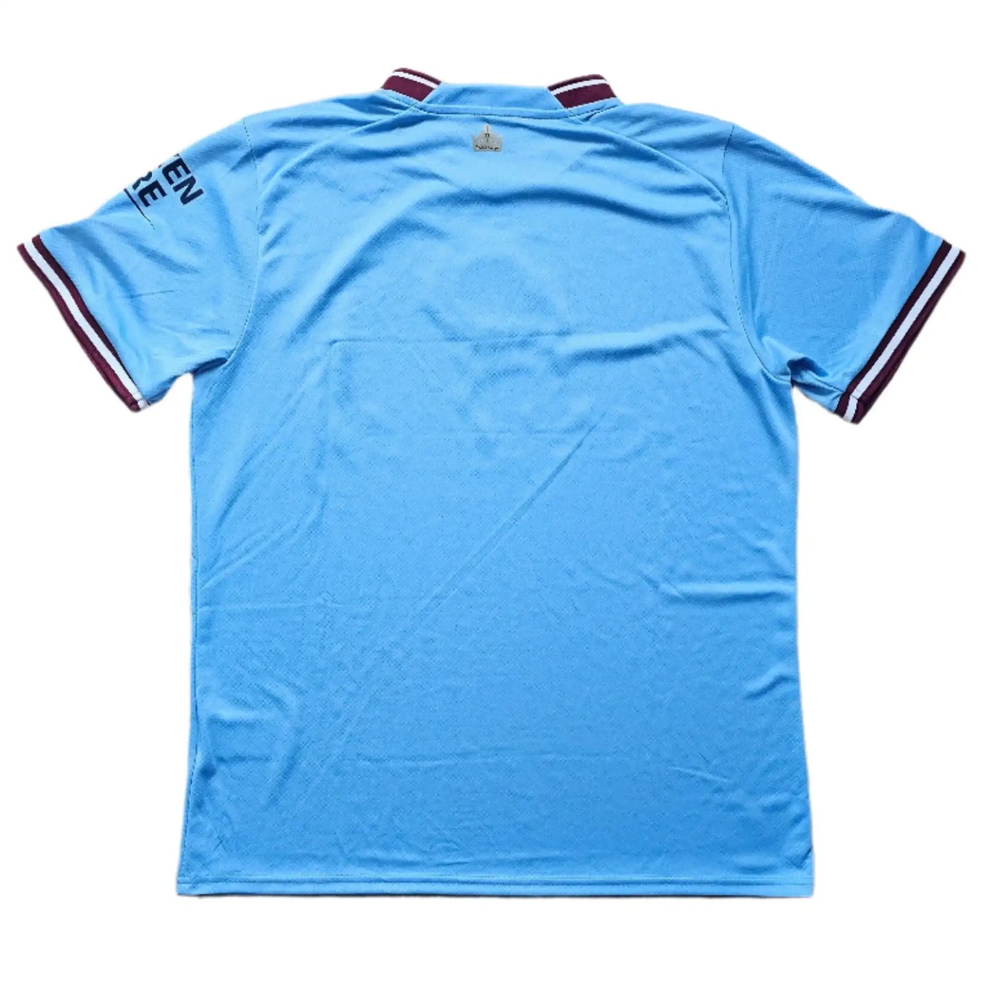 Back view of a blue football shirt featuring maroon stripes at the collar and sleeves.
