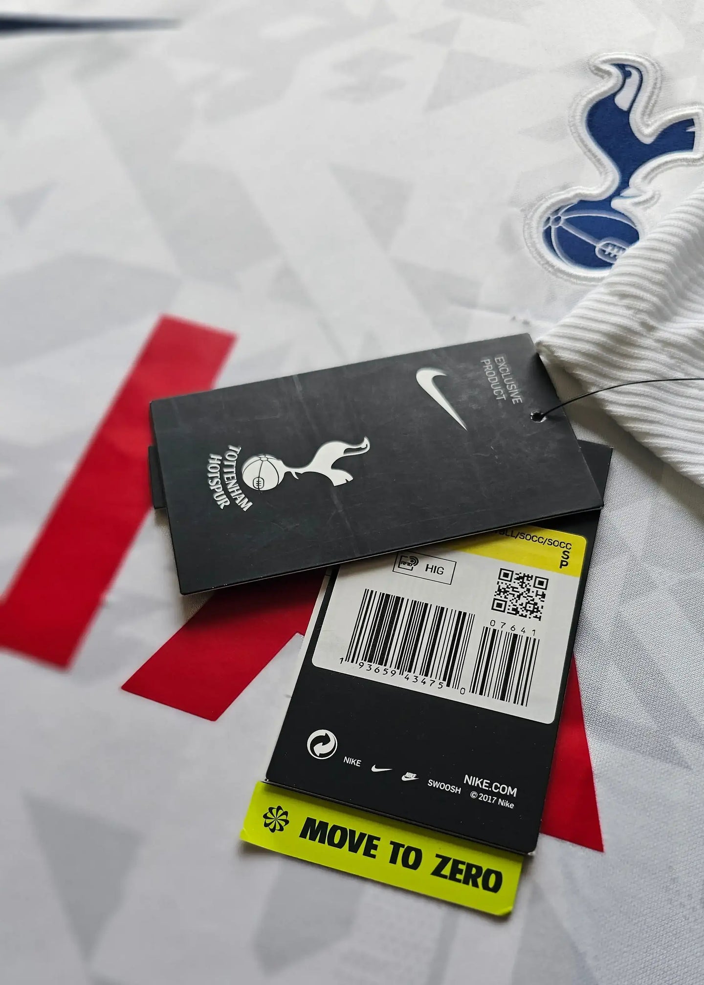 Detailed view showing Tottenham Hotspur crest and Nike tags with barcode.