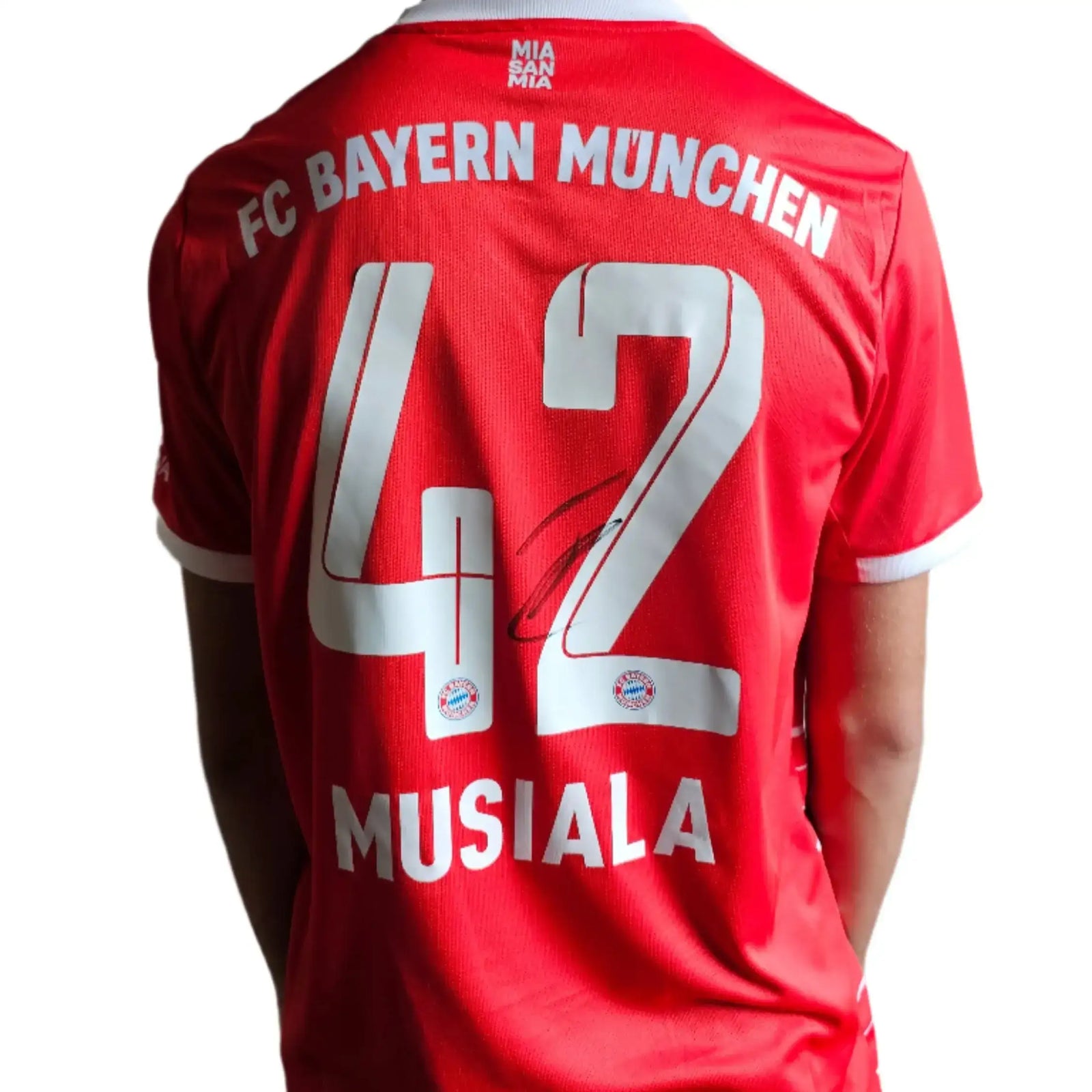 Back view showing red football shirt with FC BAYERN MUNCHEN, No. 42, MUSIALA, and signature.