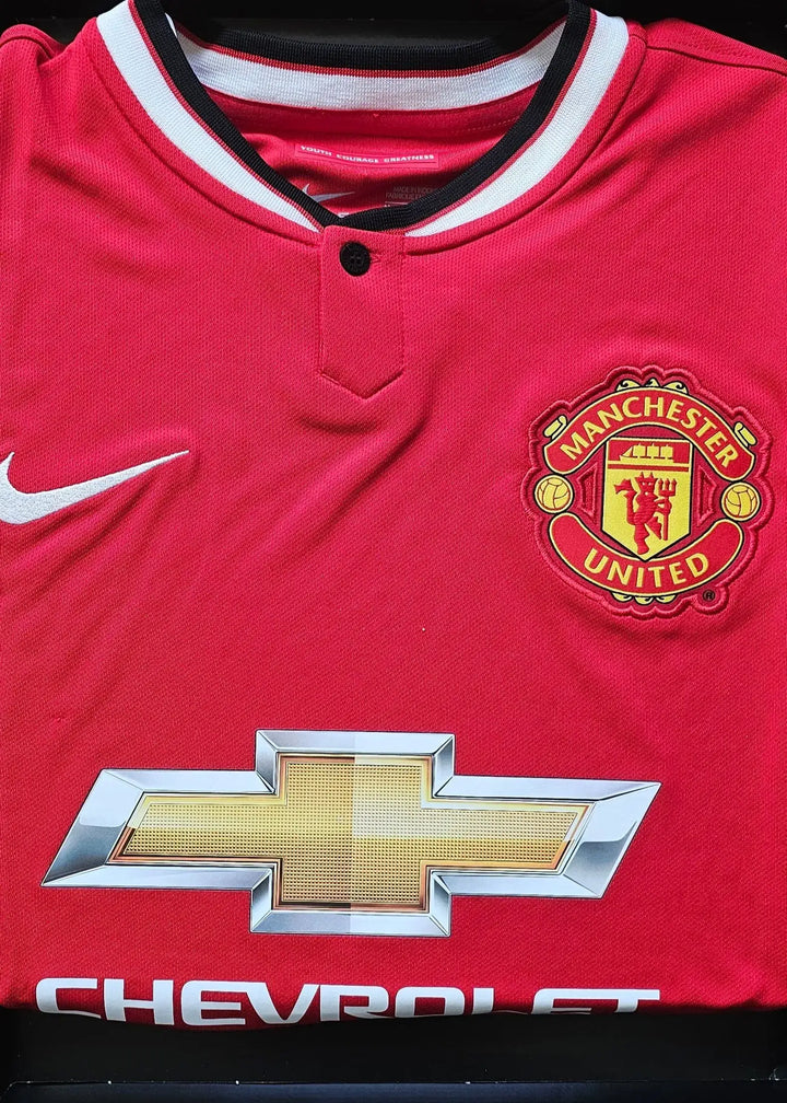 Manchester United crest, Chevrolet sponsor logo, and Nike swoosh on a red football shirt.