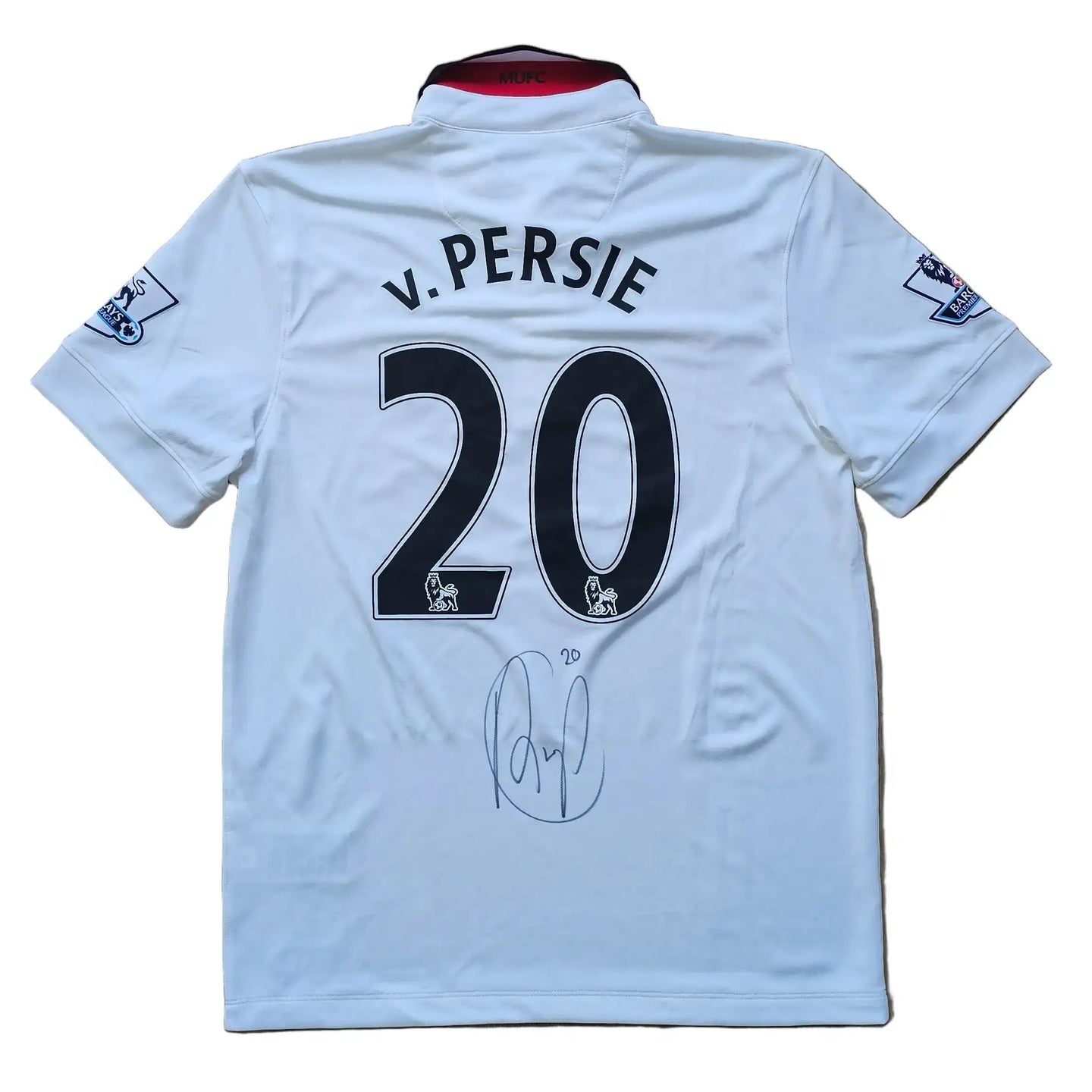 Back of a signed Manchester United shirt featuring v. Persie and No. 20 with a visible signature.
