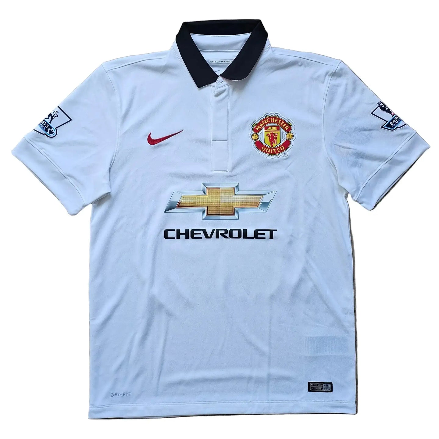 Manchester United crest, Chevrolet sponsor logo, and Nike swoosh on a white signed shirt.