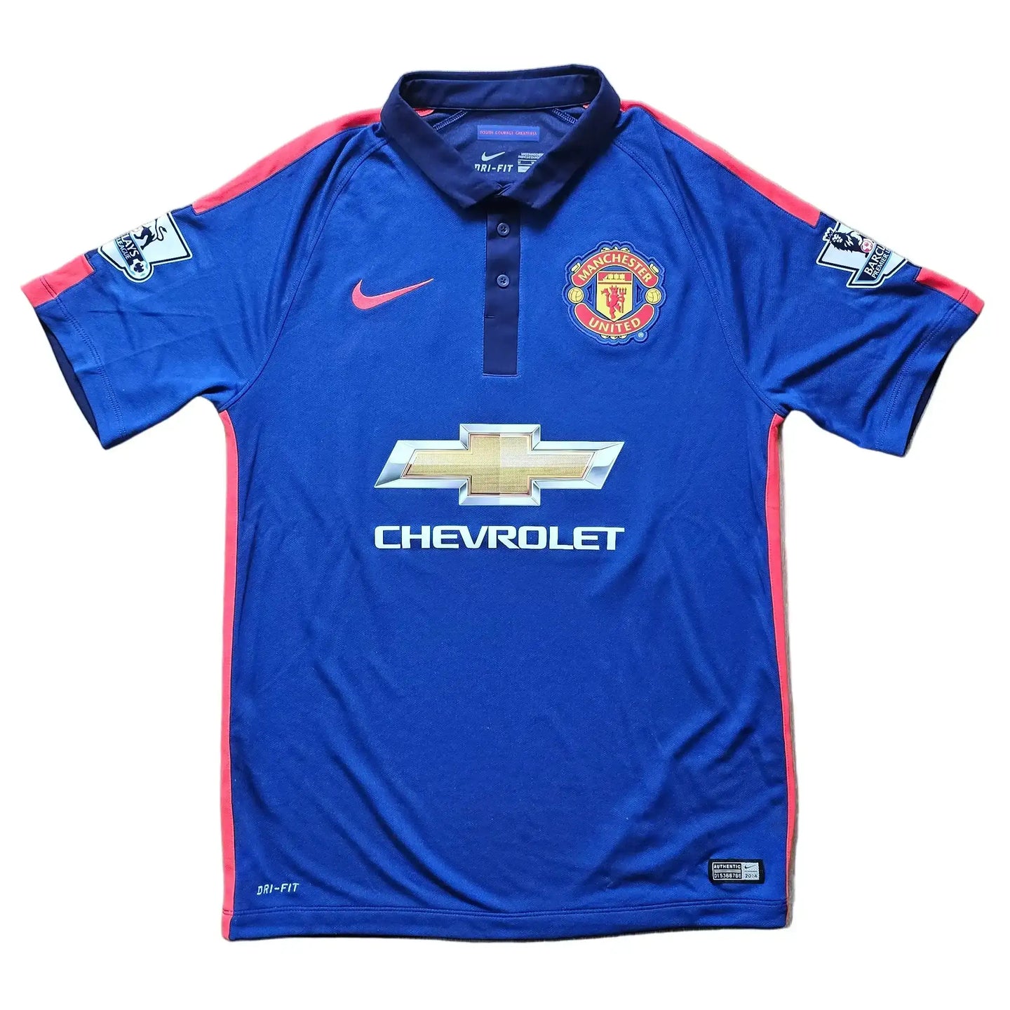 Manchester United crest, blue shirt with red accents, Chevrolet sponsor logo, DRI-FIT label.
