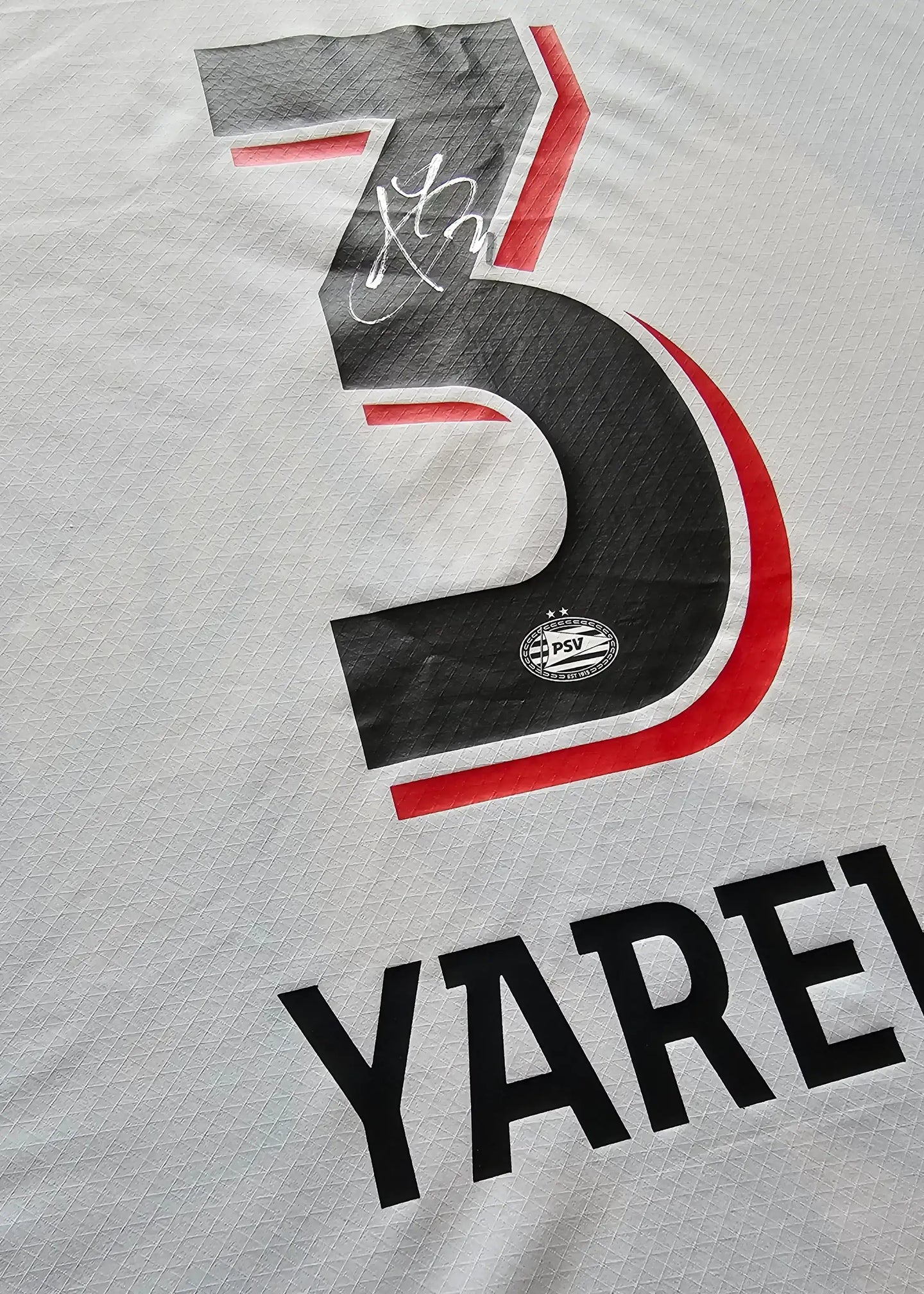 Back view showing No. 3, Yarek, and PSV crest with signature detail.