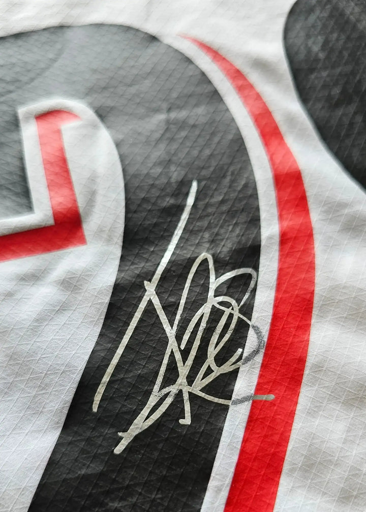Close-up of signature detail on the No. 28 PSV signed football shirt.