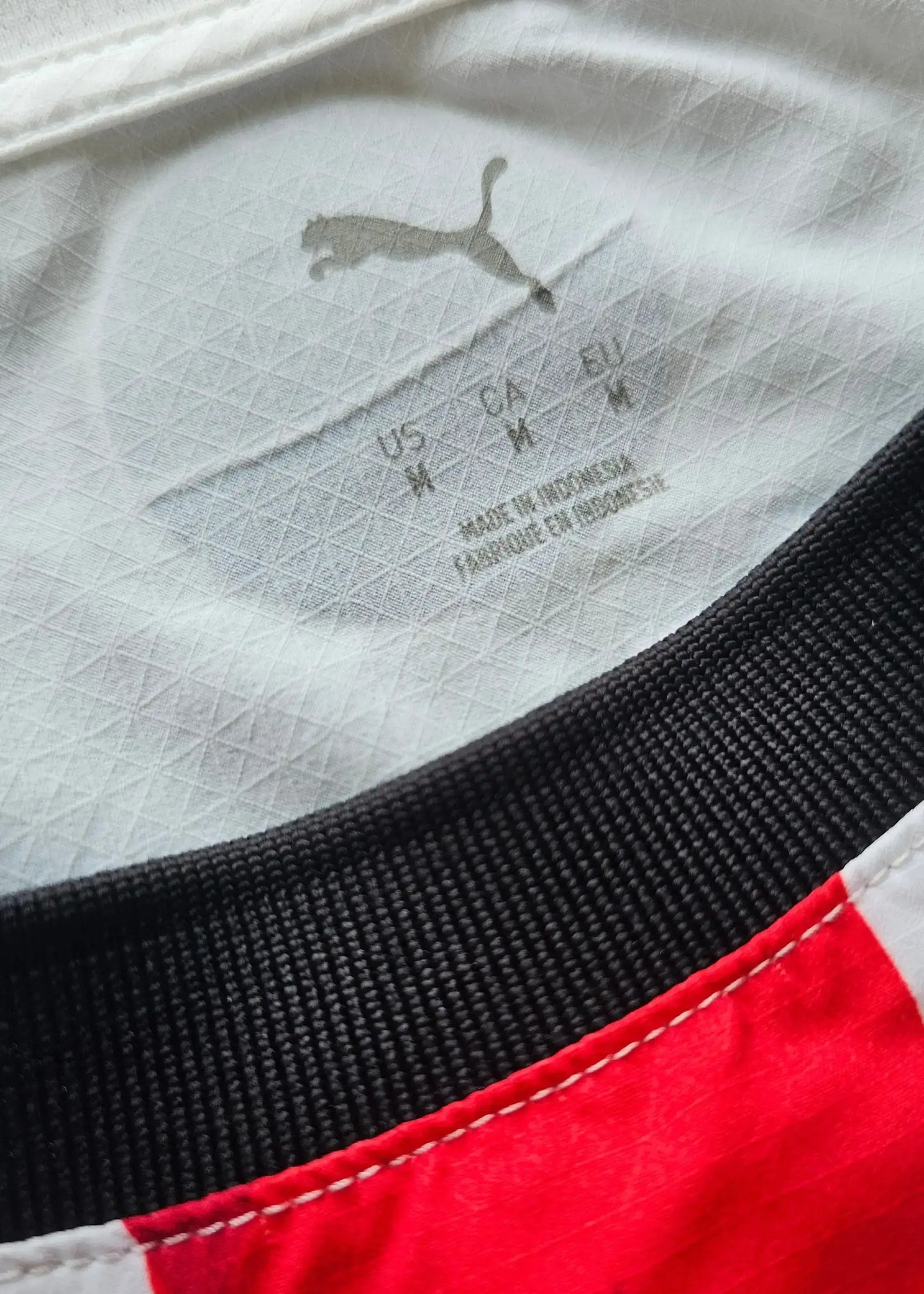 Inside label showing size M, Puma logo, and 'MADE IN INDONESIA'.