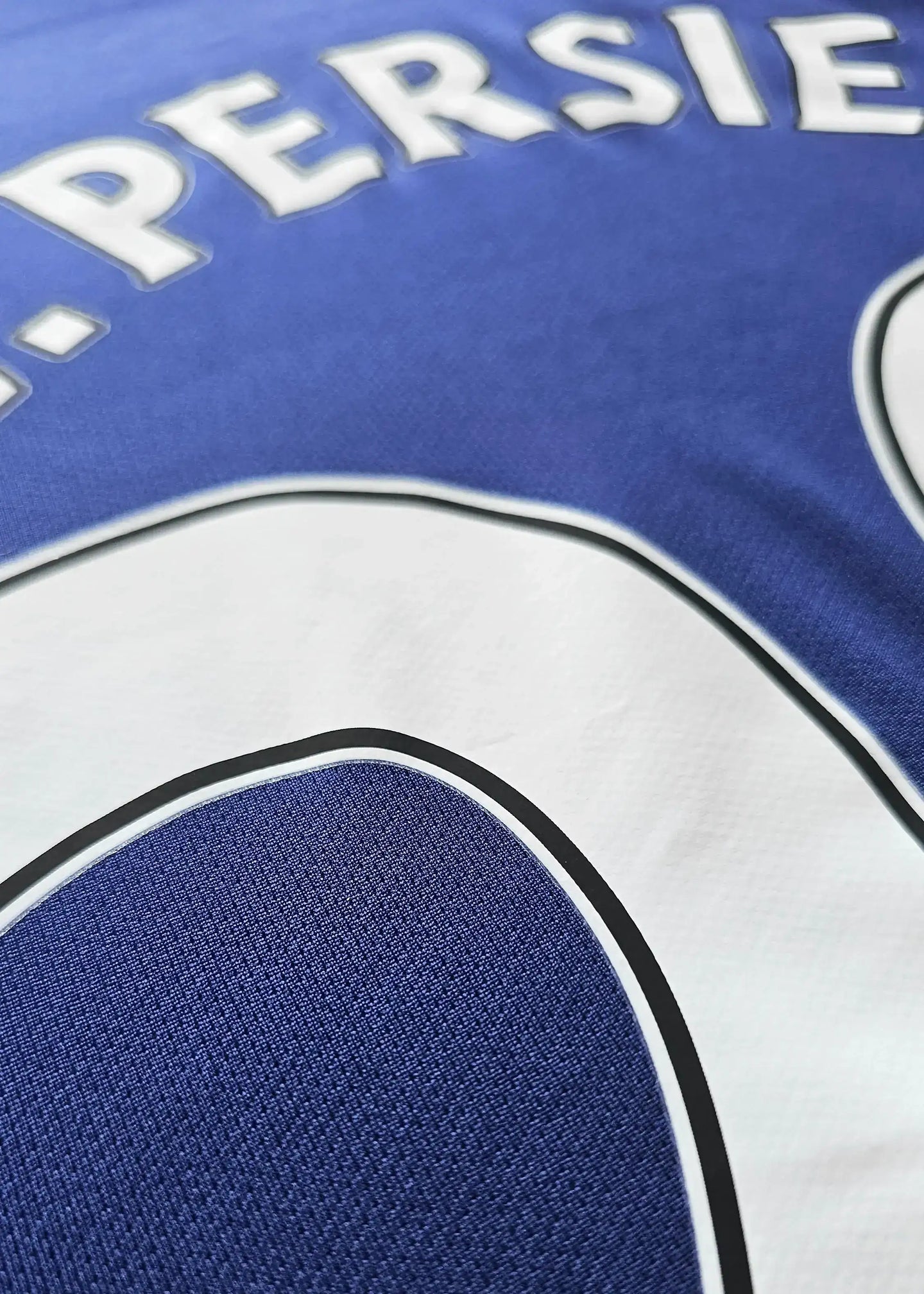 Back view of signed Manchester United jersey with name 'PERSIE' and No. 20 in white.