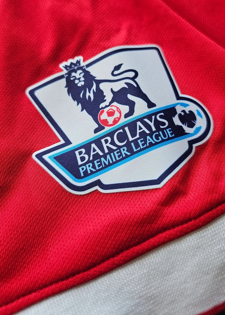 Barclays Premier League crest detail on a red Manchester United shirt.