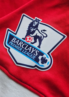 Barclays Premier League crest on a red Manchester United shirt.