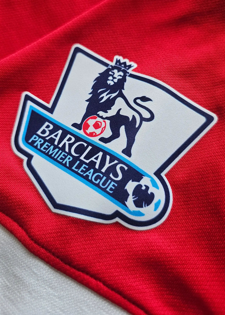 Barclays Premier League crest on a red Manchester United shirt.