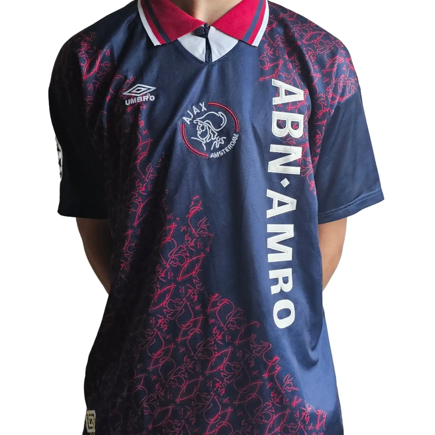 Back view showing signature and the ABN AMRO sponsor on a Jari Litmanen Ajax soccer jersey.