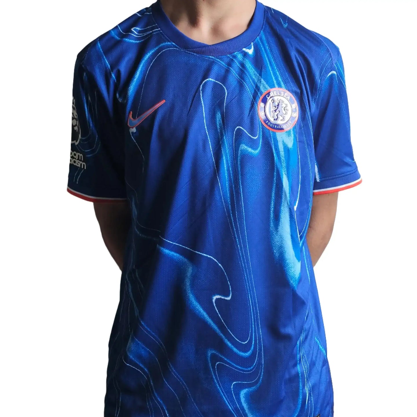 Back view of a Chelsea 2024-2025 football shirt with blue and red accents and the Chelsea crest.