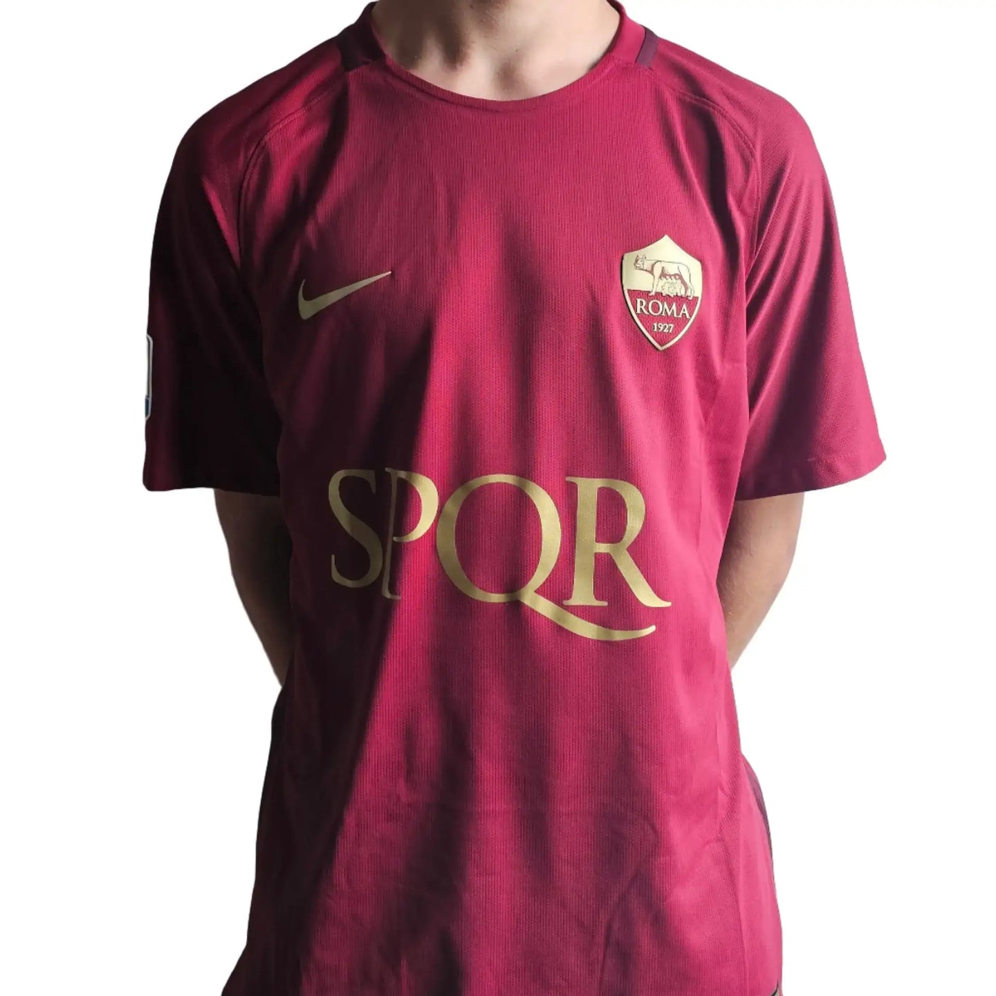 Back view of signed football shirt featuring A.S. Roma crest and SPQR emblem.