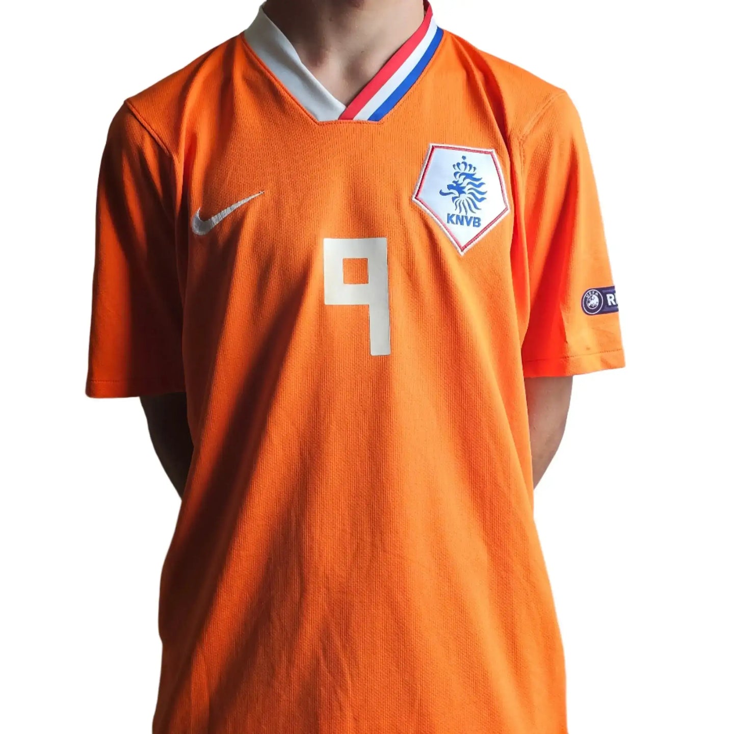 Back view showing No. 9 and KNVB crest on an orange football shirt.