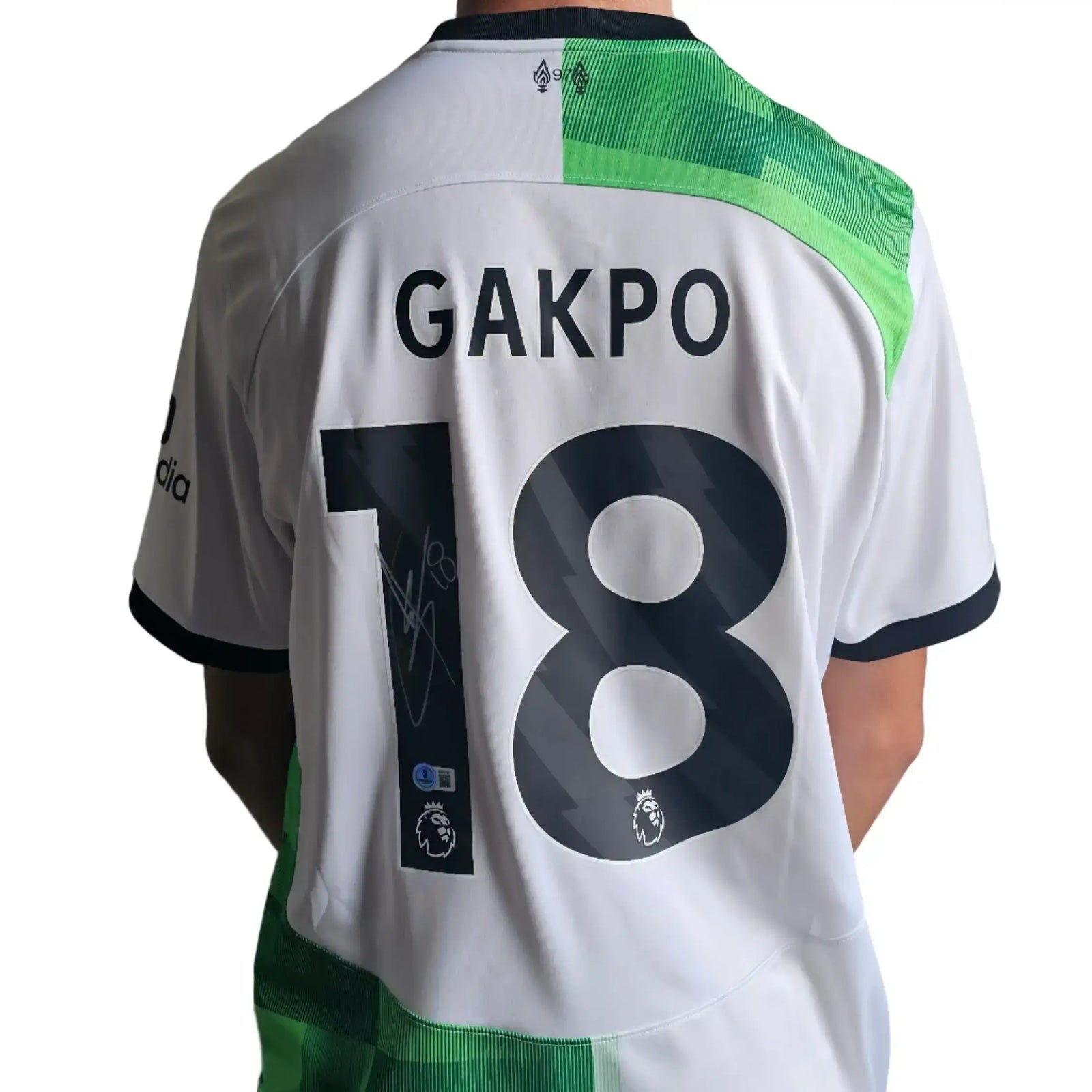 Back view showing GAKPO and No. 18 with a signature on this Liverpool football shirt.