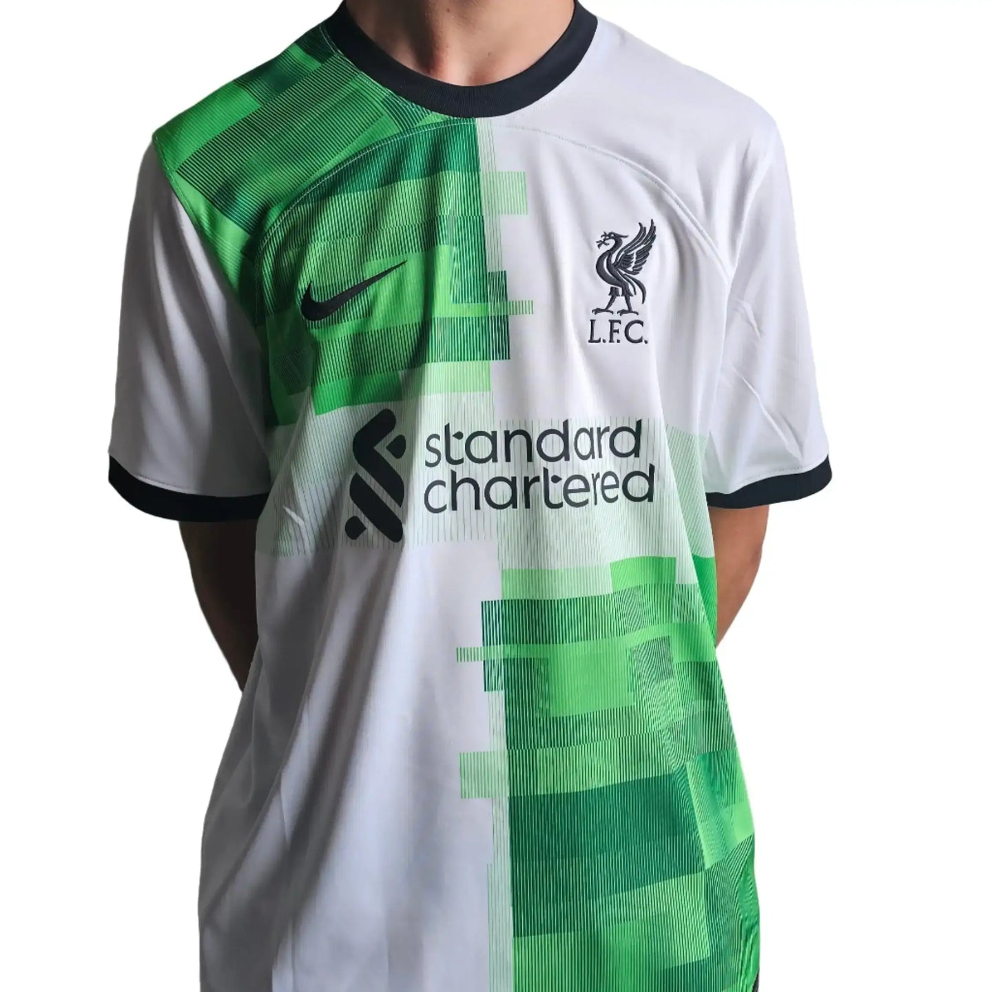 Front view showing Liverpool crest, Nike logo, and 'standard chartered' sponsor text.