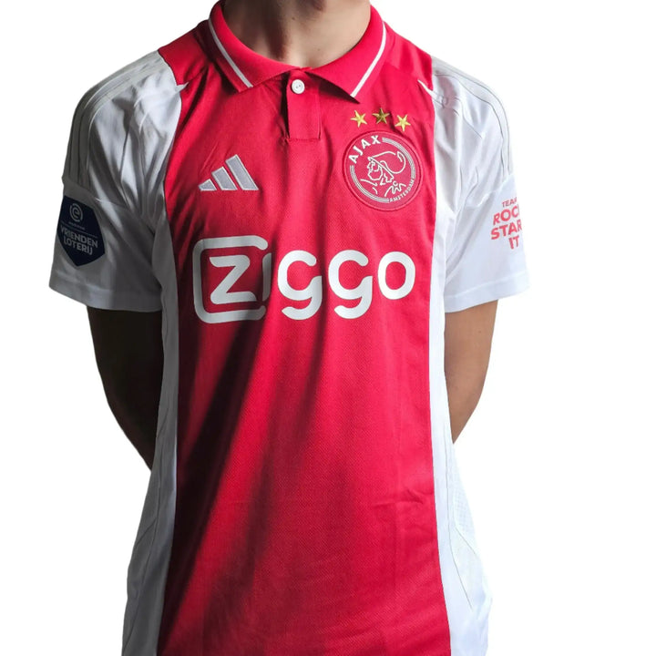Back view of Ajax football shirt featuring No. 31 and Ziggo sponsor logo.