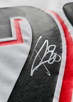 Close-up of the signature on the Tygo Land 28 PSV signed match-worn shirt.