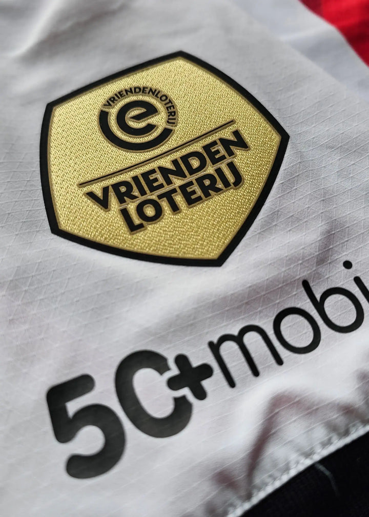 VriendenLoterij golden crest and 5C+mobi sponsor text on a white PSV shirt.