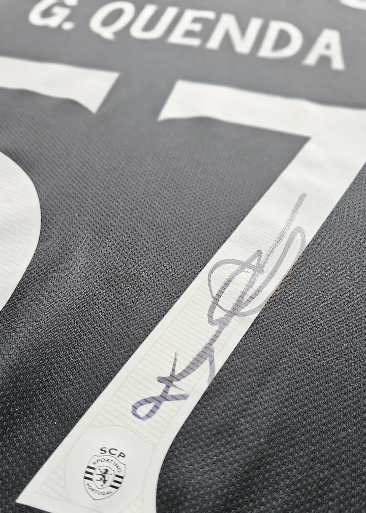 Signature of G. Quenda on the number 57 with Sporting CP crest detail.