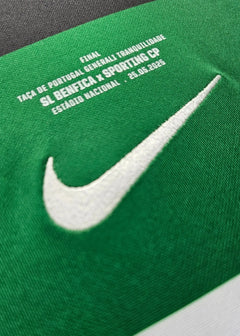 Nike logo and tournament details for SL Benfica vs Sporting CP match on green fabric.