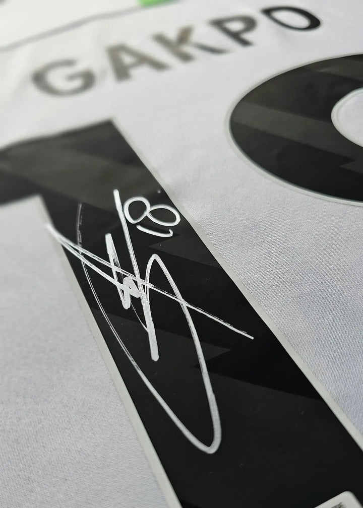 Close-up of No. 18 GAKPO with signature on back of the signed Liverpool football shirt.