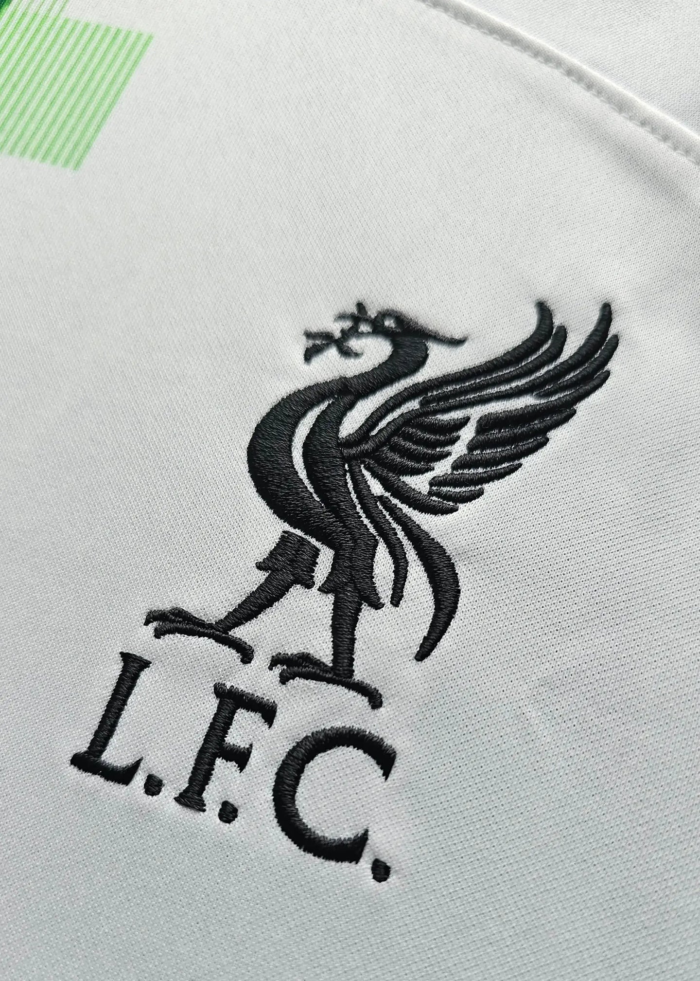 Close-up of Liverpool crest featuring the Liver bird and L.F.C. text.