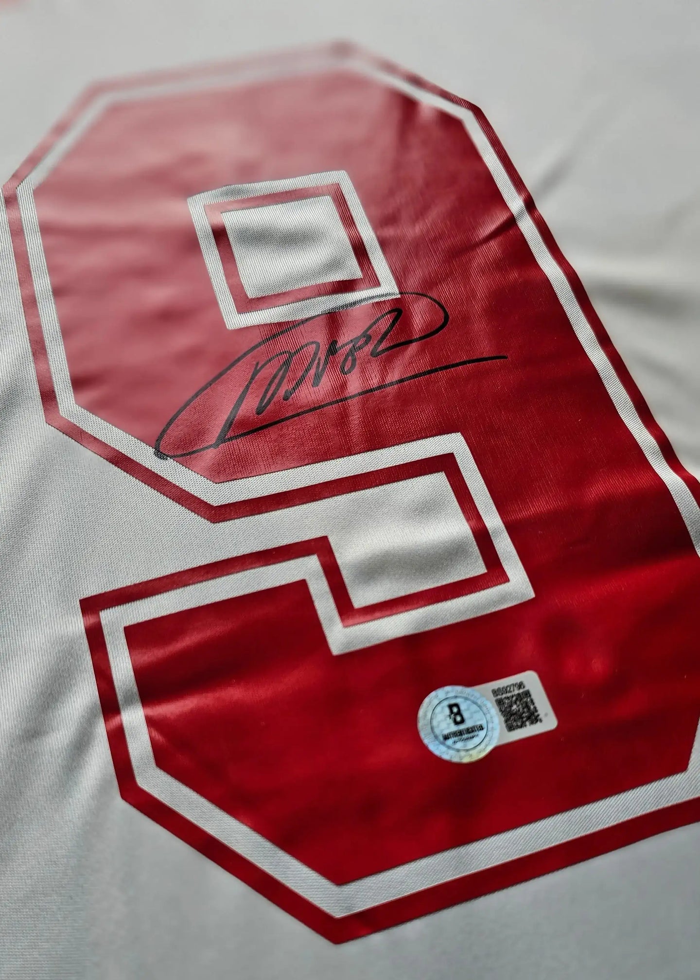 Back view featuring No. 9 and signature of Marco van Basten on an AC Milan football shirt.