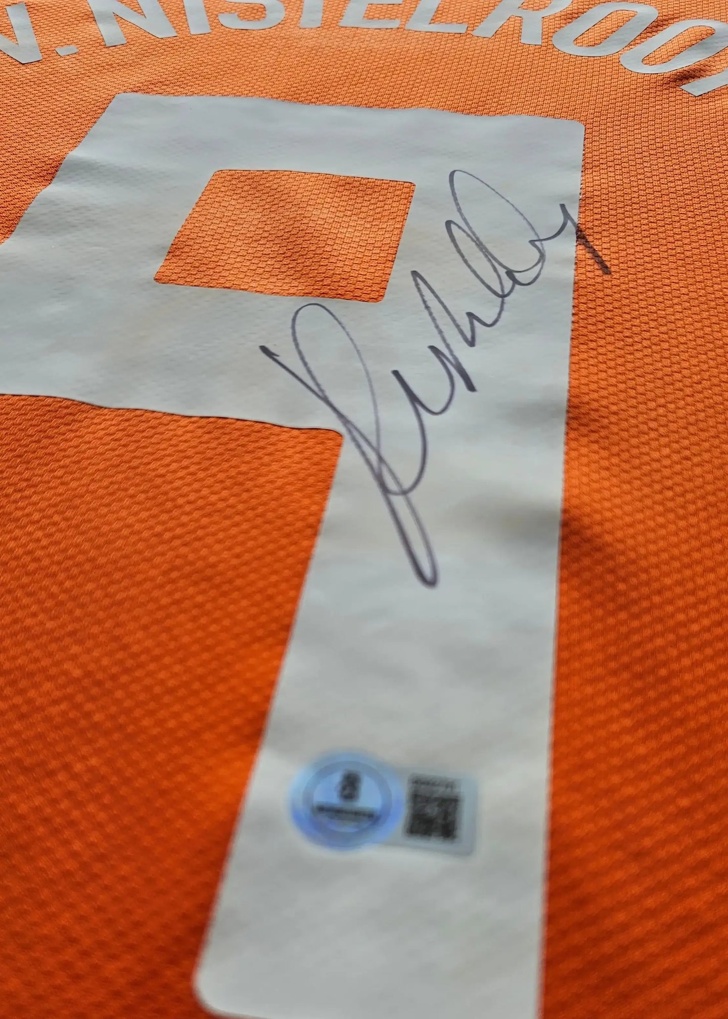 Detail view showing No. 9, signature of Ruud van Nistelrooij, and authentication tag.