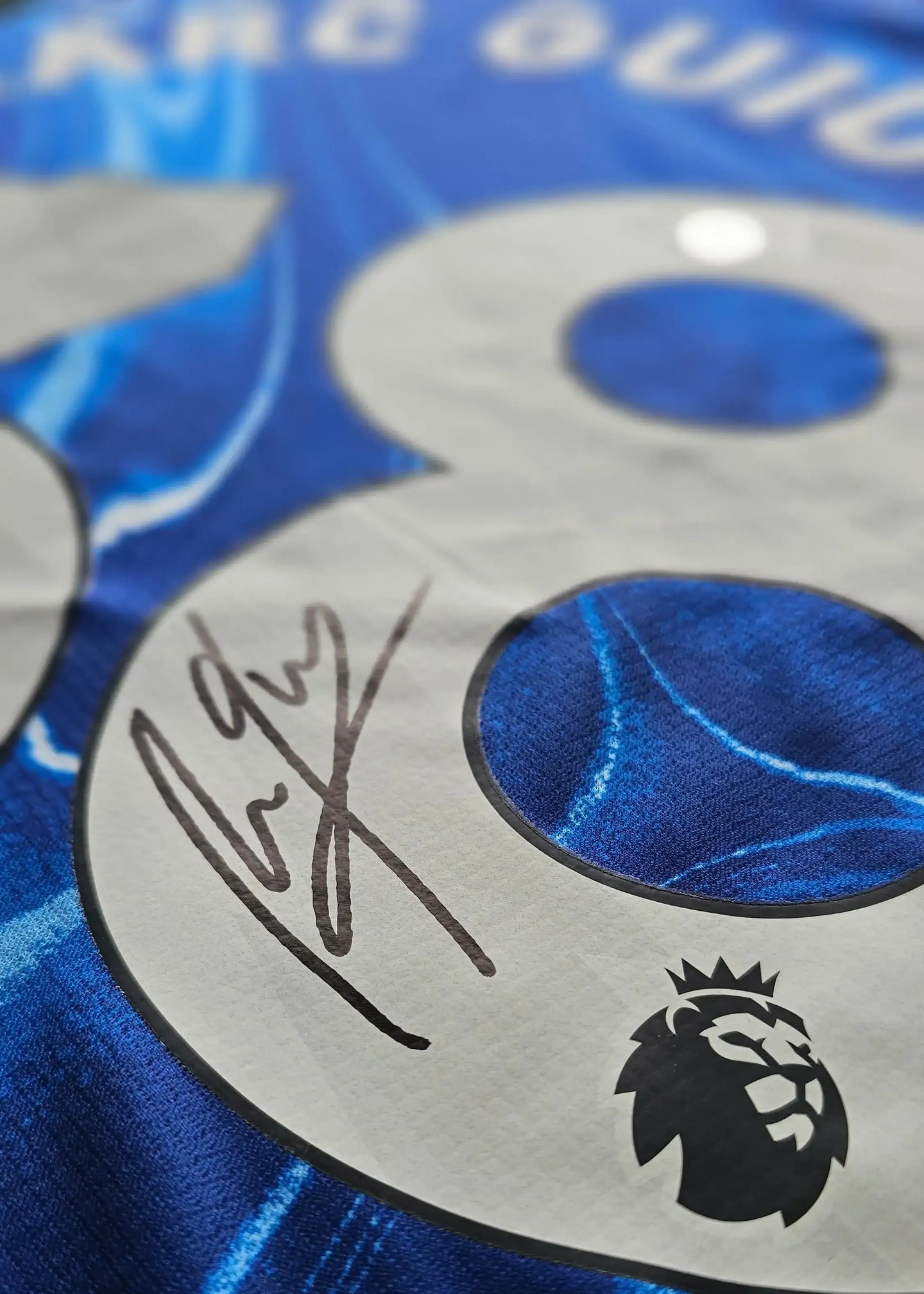 Close-up of No. 38 with signature detail on a Chelsea 2024-2025 signed football shirt.