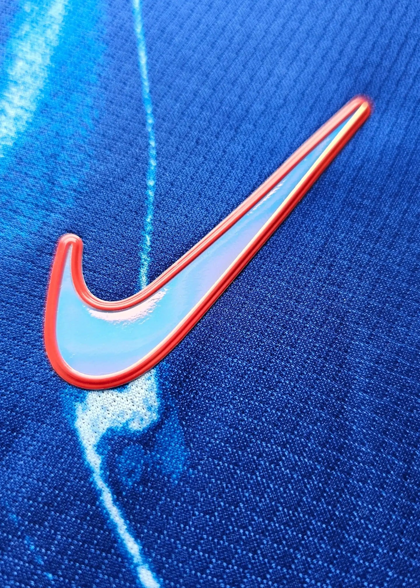 Close-up of the Nike logo on Marc Guiu Paz's signed Chelsea football shirt.