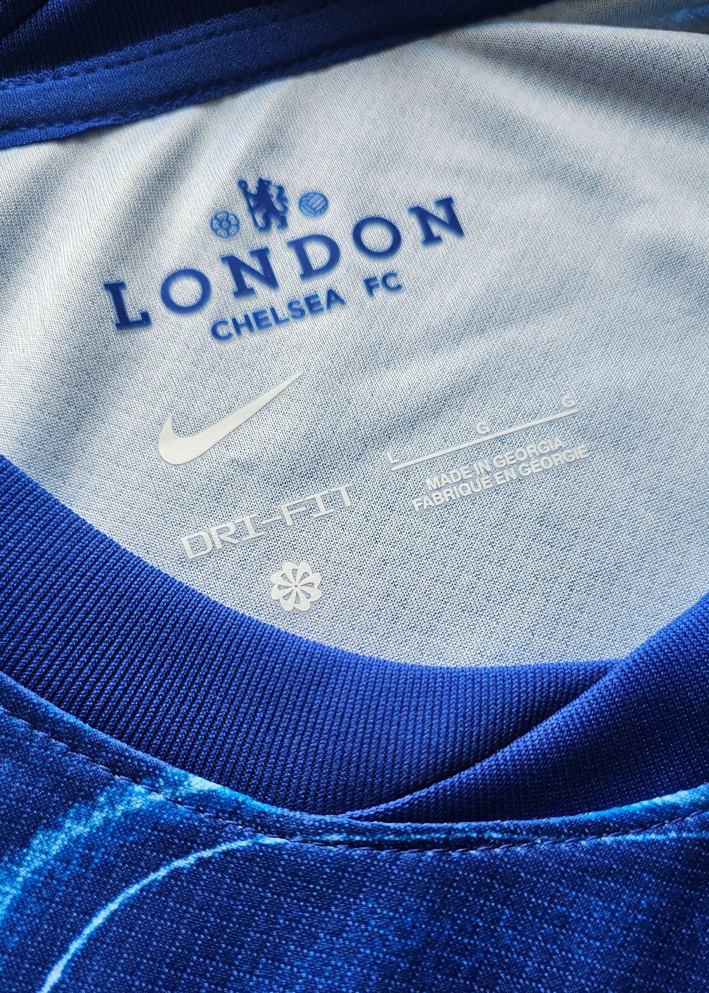 Detail view showing 'LONDON CHELSEA FC', Nike logo, DRI-FIT label, and care information.