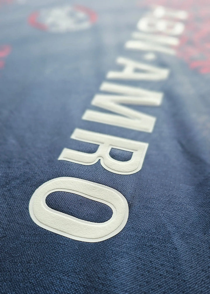 Back view showing No. 10 on a blue Jari Litmanen signed football shirt.