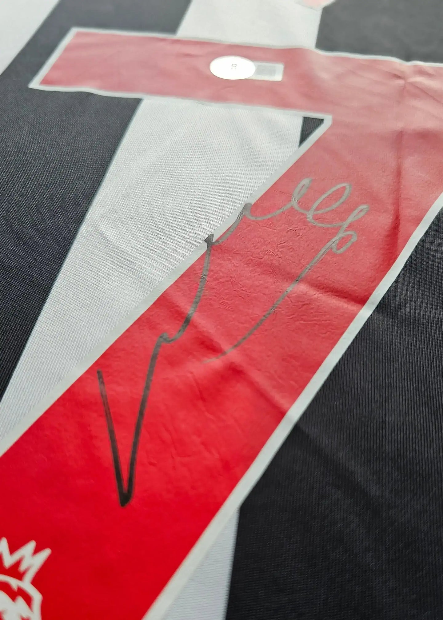 Back view showing No. 67 and a visible signature.