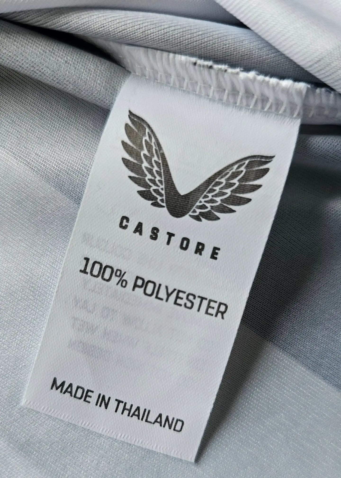 Care label showing CASTORE, 100% POLYESTER, and MADE IN THAILAND.