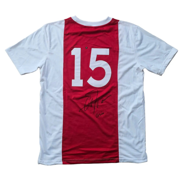 Back view of a signed Ajax jersey featuring player No. 15 and Arie Haan's signature.