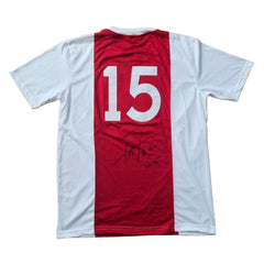 Back view of a signed Ajax football shirt featuring No. 15 and a visible signature.