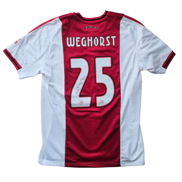 Back view of a signed Ajax shirt featuring Weghorst, No. 25, and visible signature.