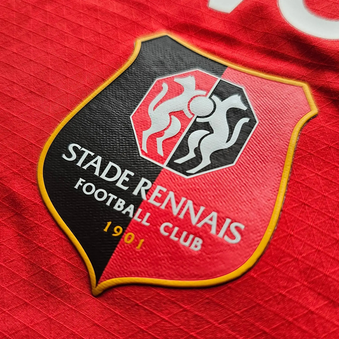 Stade Rennais Football Club logo on a red background