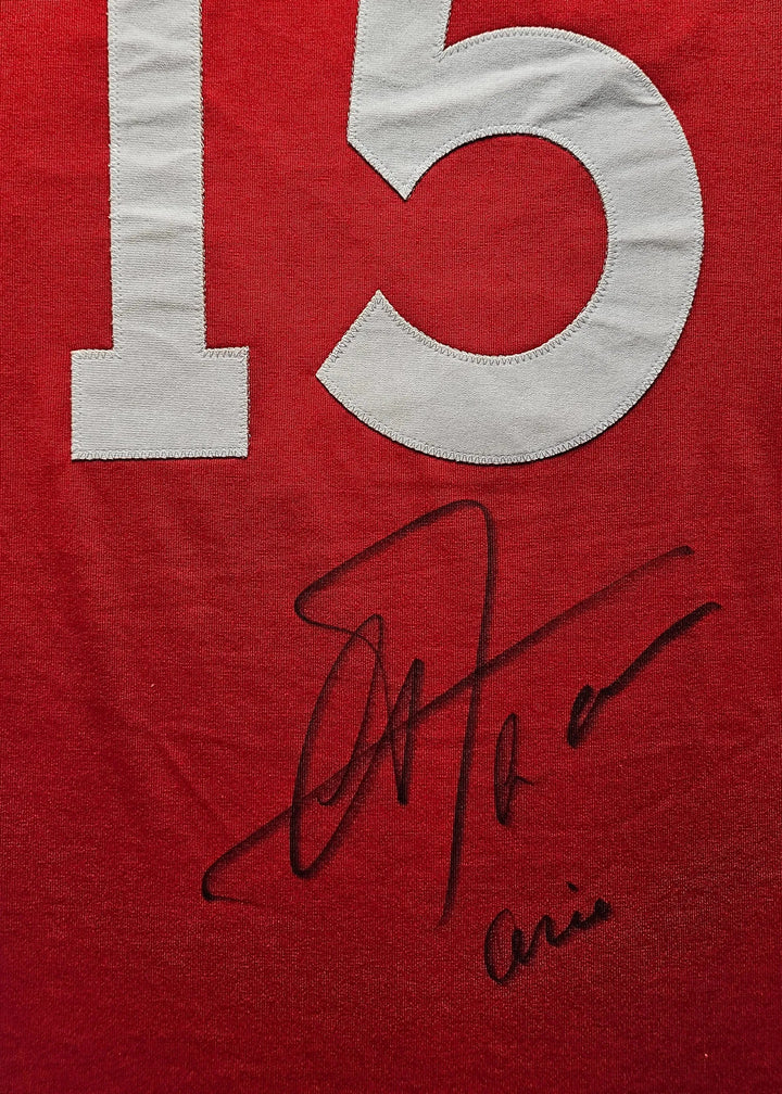 Red jersey featuring No. 15 and the signature of Arie Haan.