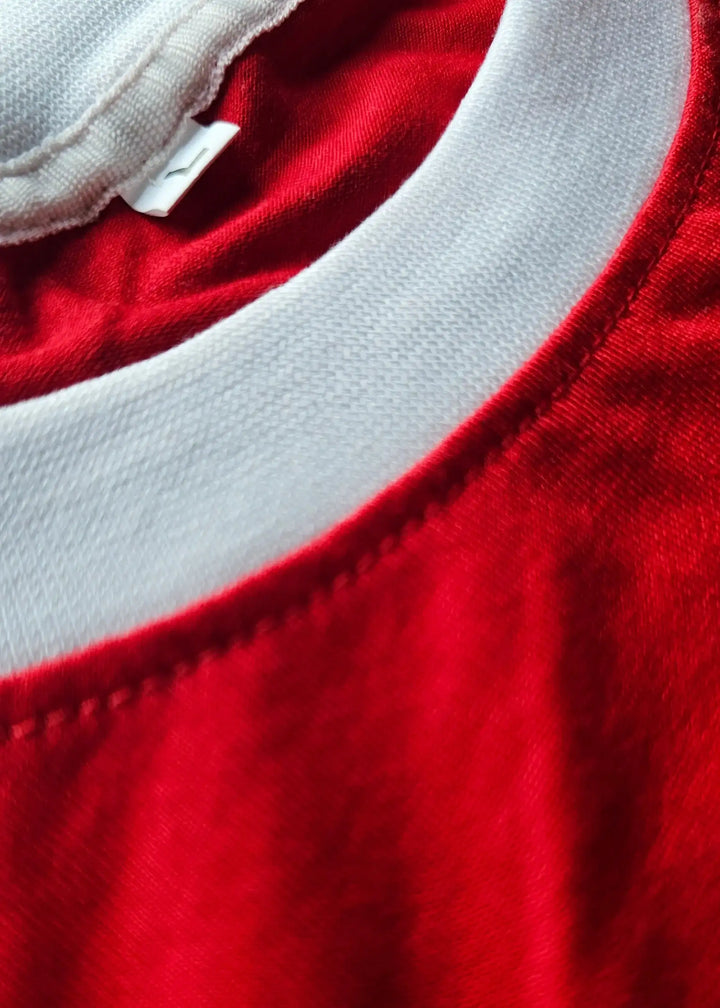 Close-up view of the red collar detail on the Arie Haan 15 Ajax signed soccer jersey.